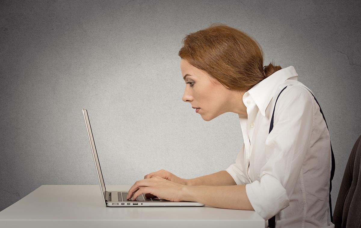 woman working on computer sitting at desk